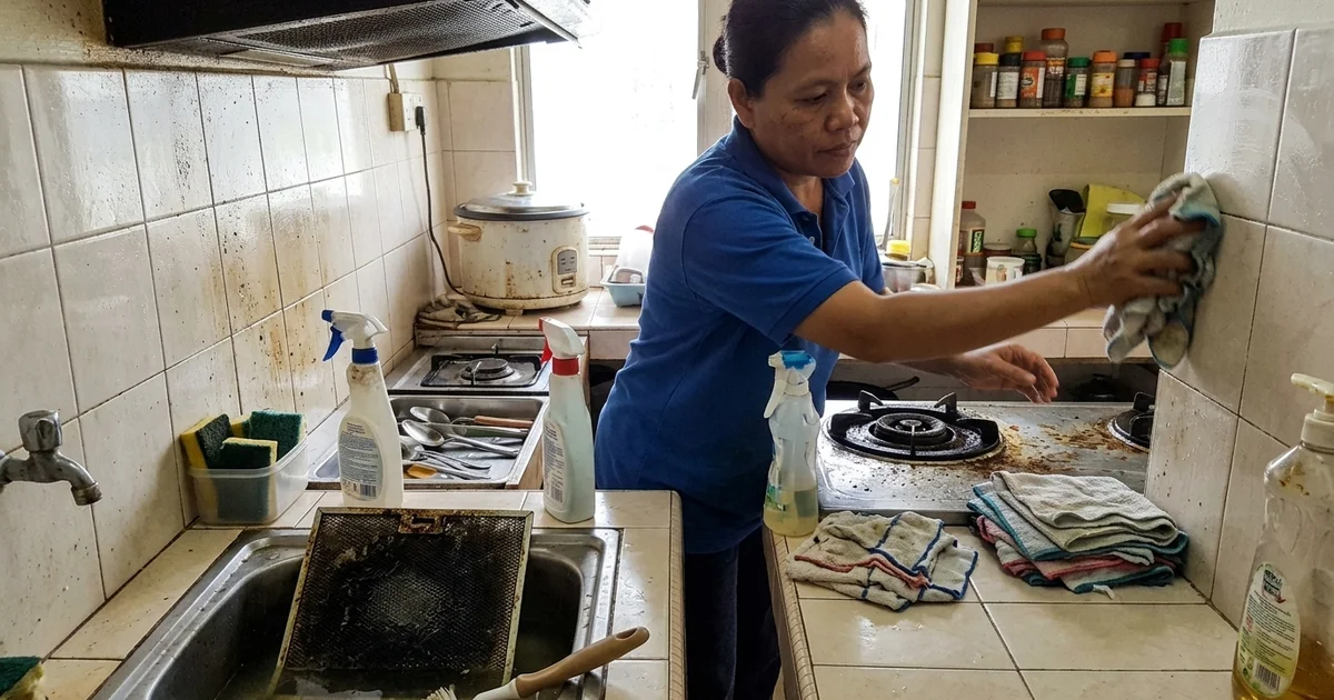 Cleaner deep cleaning a neglected kitchen